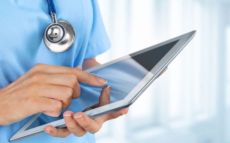 Healthcare IT Services Supporting Doctor Using Tablet